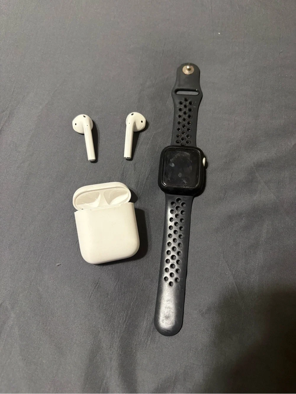 Apple AirPods (White) with Apple Watch Sport Band (Black)